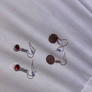 red jewel earring and bronze earring